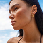Amo earrings, close-up of the serpent coiled around the heart