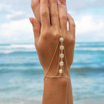 Amaanyi gemstone hand chain in gold-plated silver, styled look