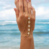 Amaanyi gemstone hand chain in gold-plated silver, styled look