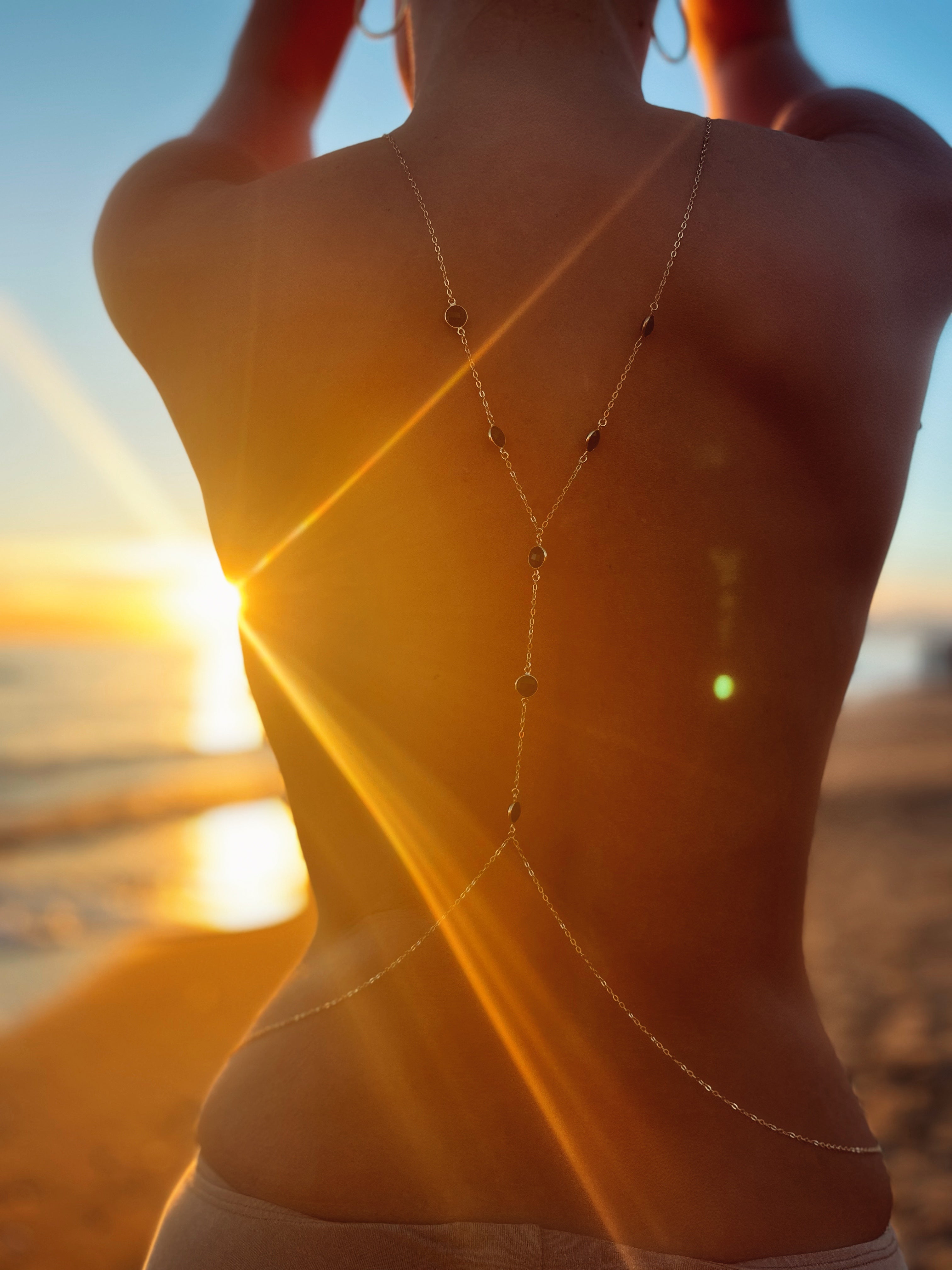 Inerci gemstone body chain, product detail against a neutral background
