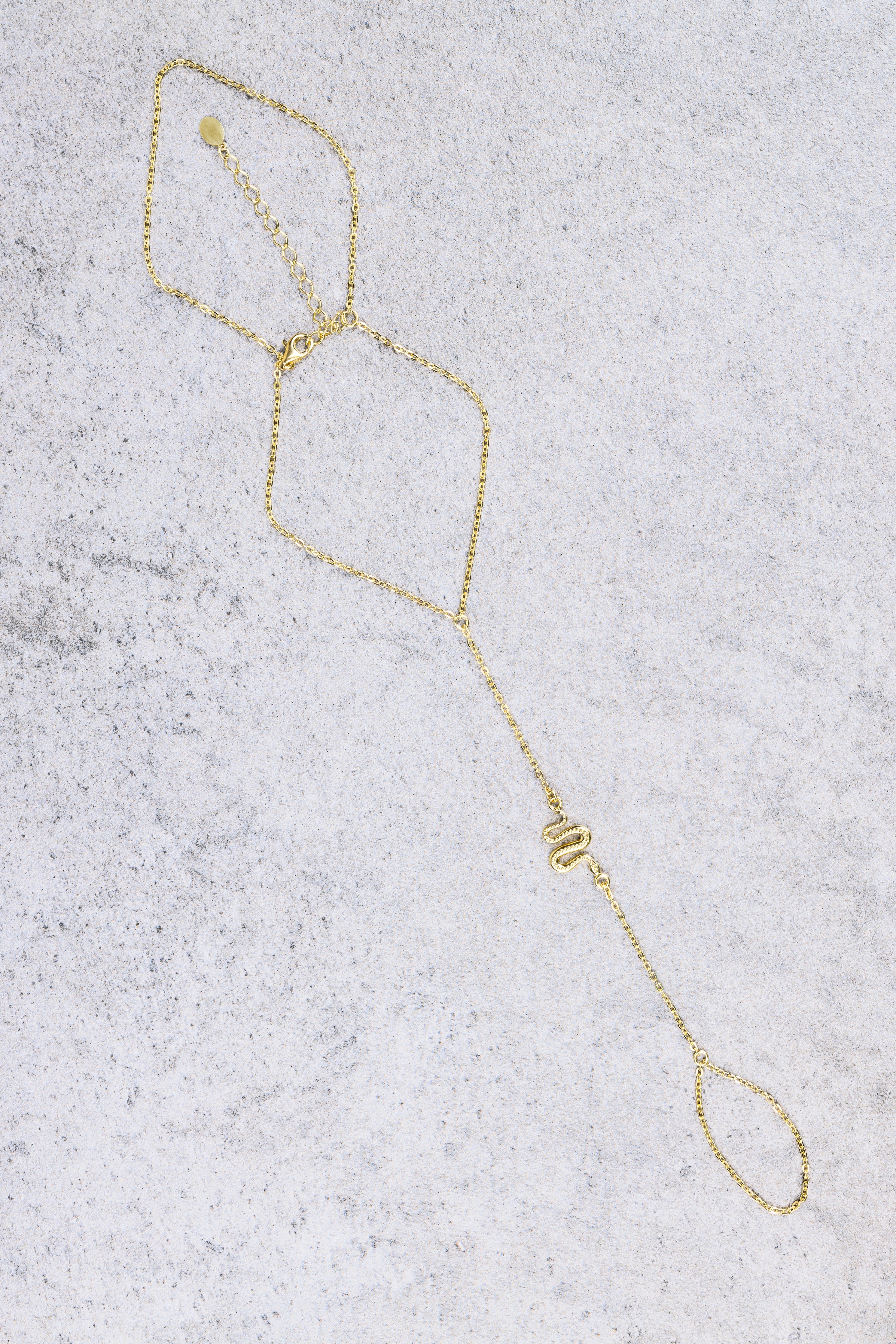 Nahesa serpent hand chain, flat lay product photo