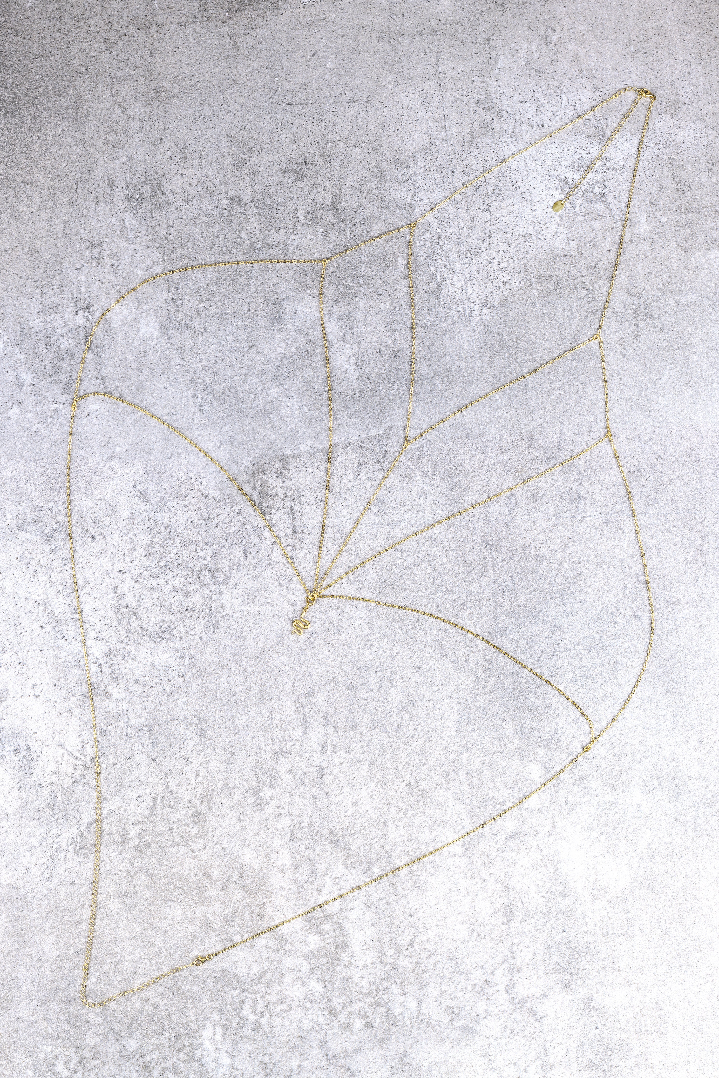 Lota body chain, close-up of the detachable serpent detail