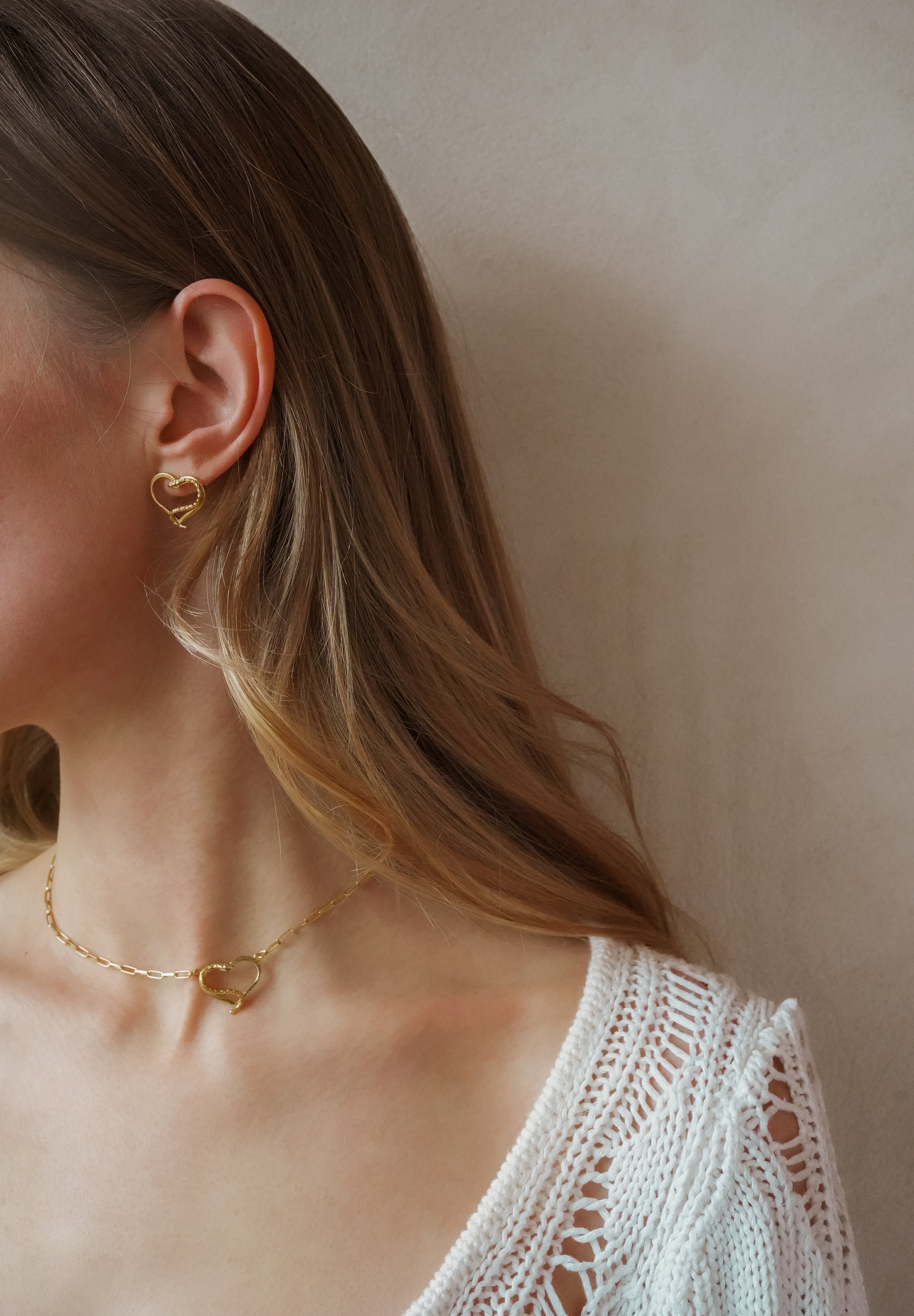 Amo earrings worn as part of a matching set with the necklace