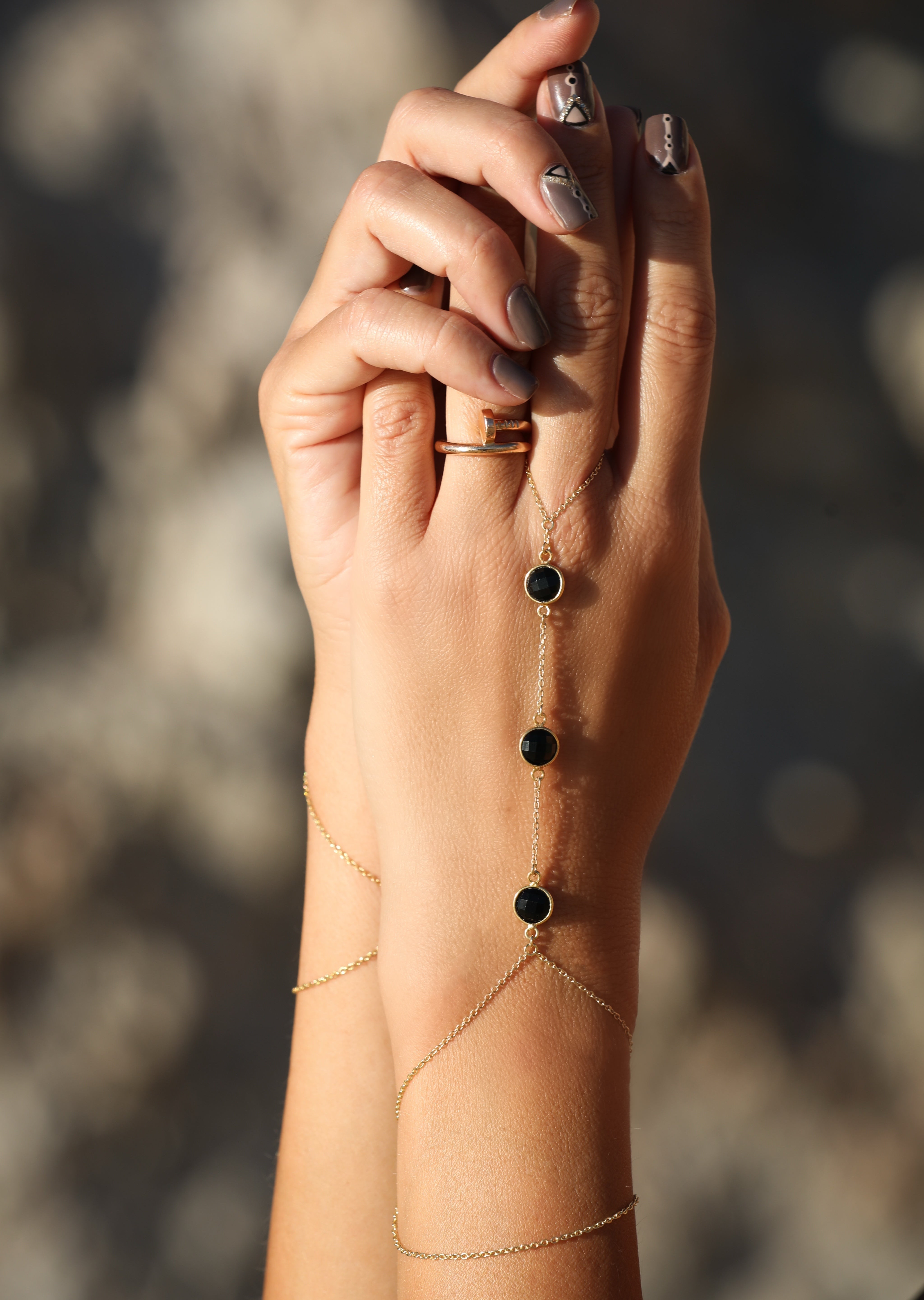 Nishati gemstone hand chain, close-up of the three stone composition