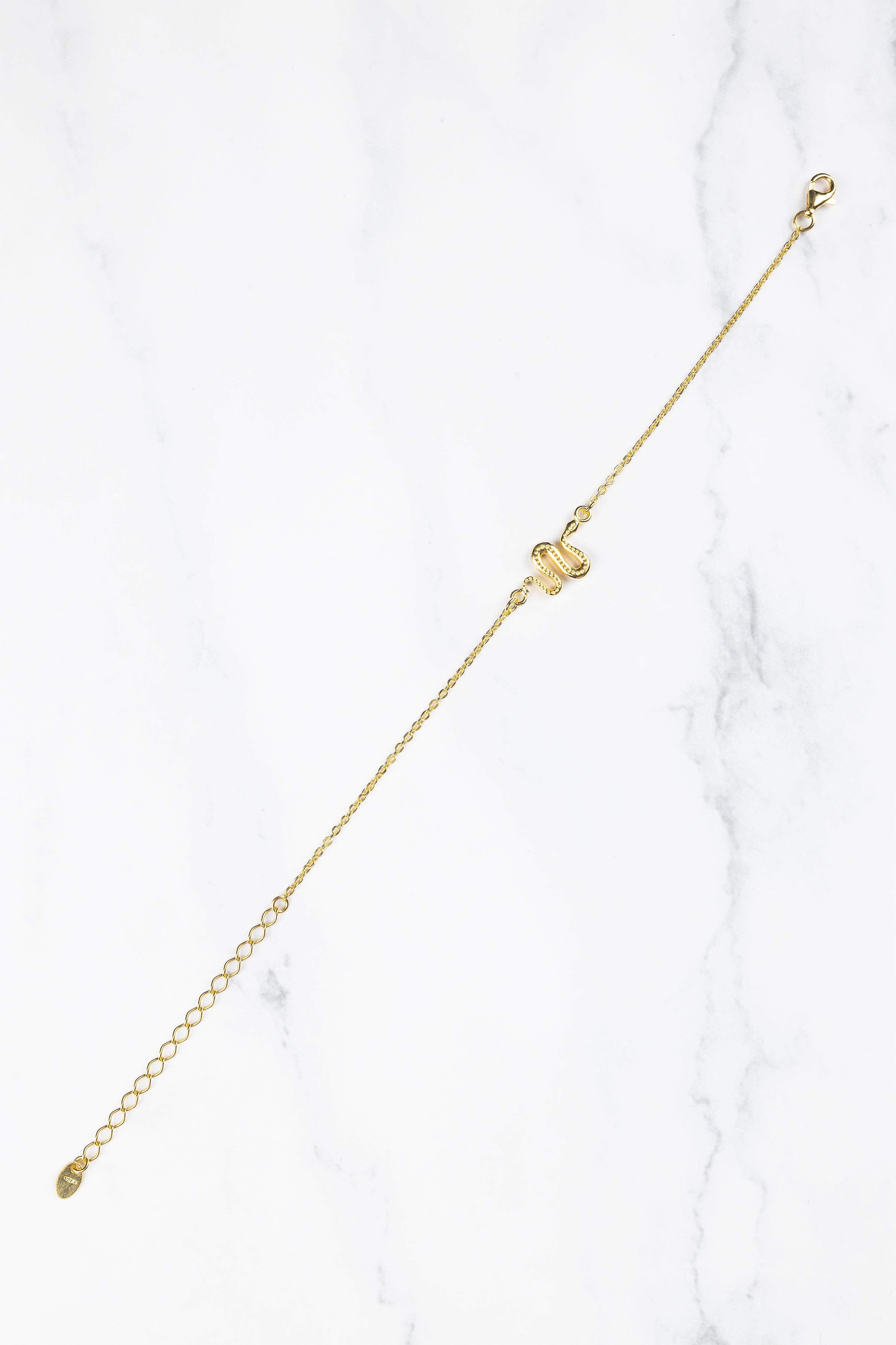 Ular serpent bracelet, product detail against a neutral background