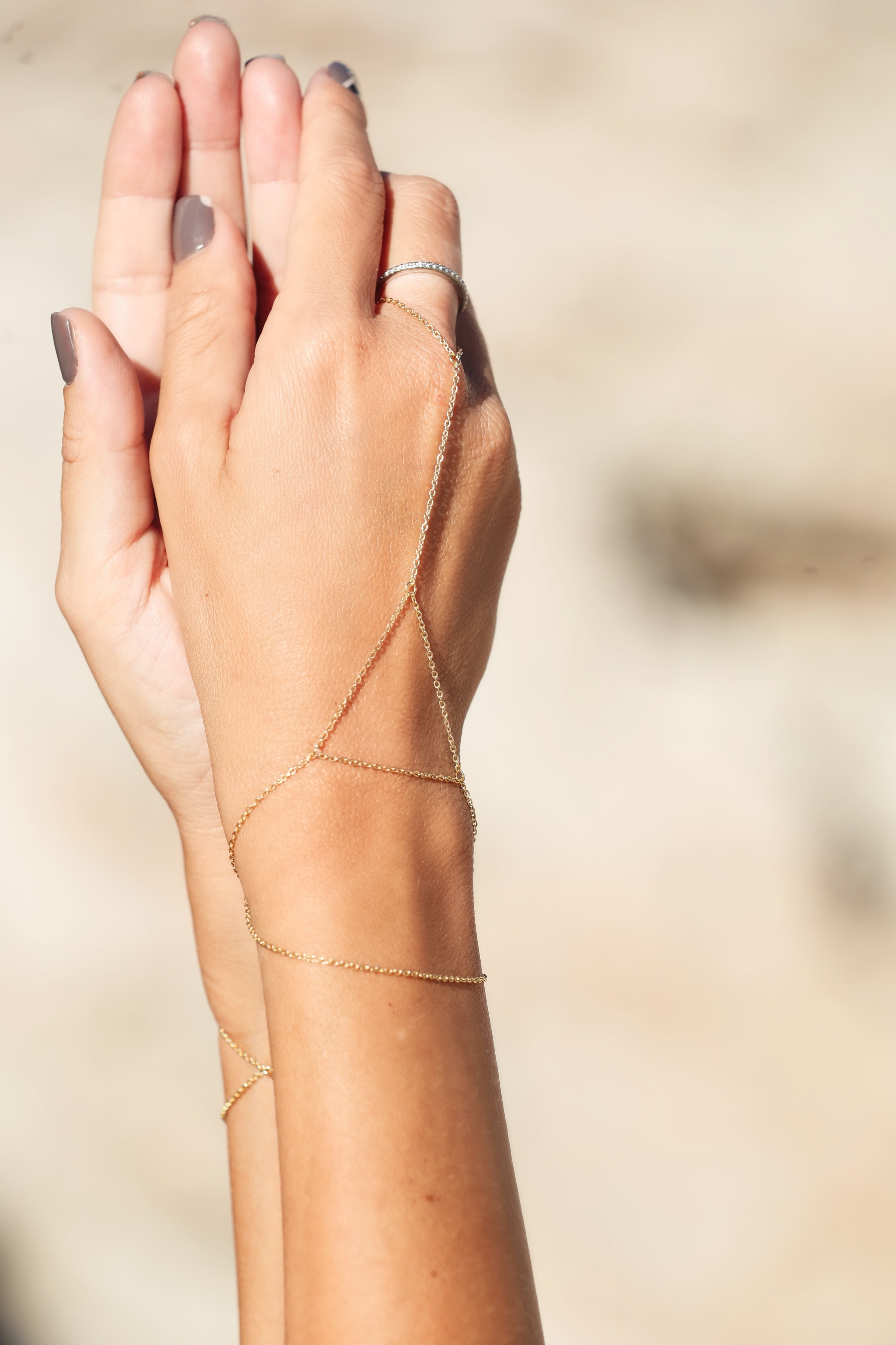 Sanje hand chain, product detail against a neutral background