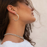 Sarpe serpent hoop earrings, close-up of the clean curve