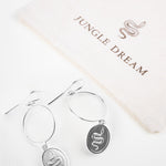 Madu drop earrings, product detail against a neutral background