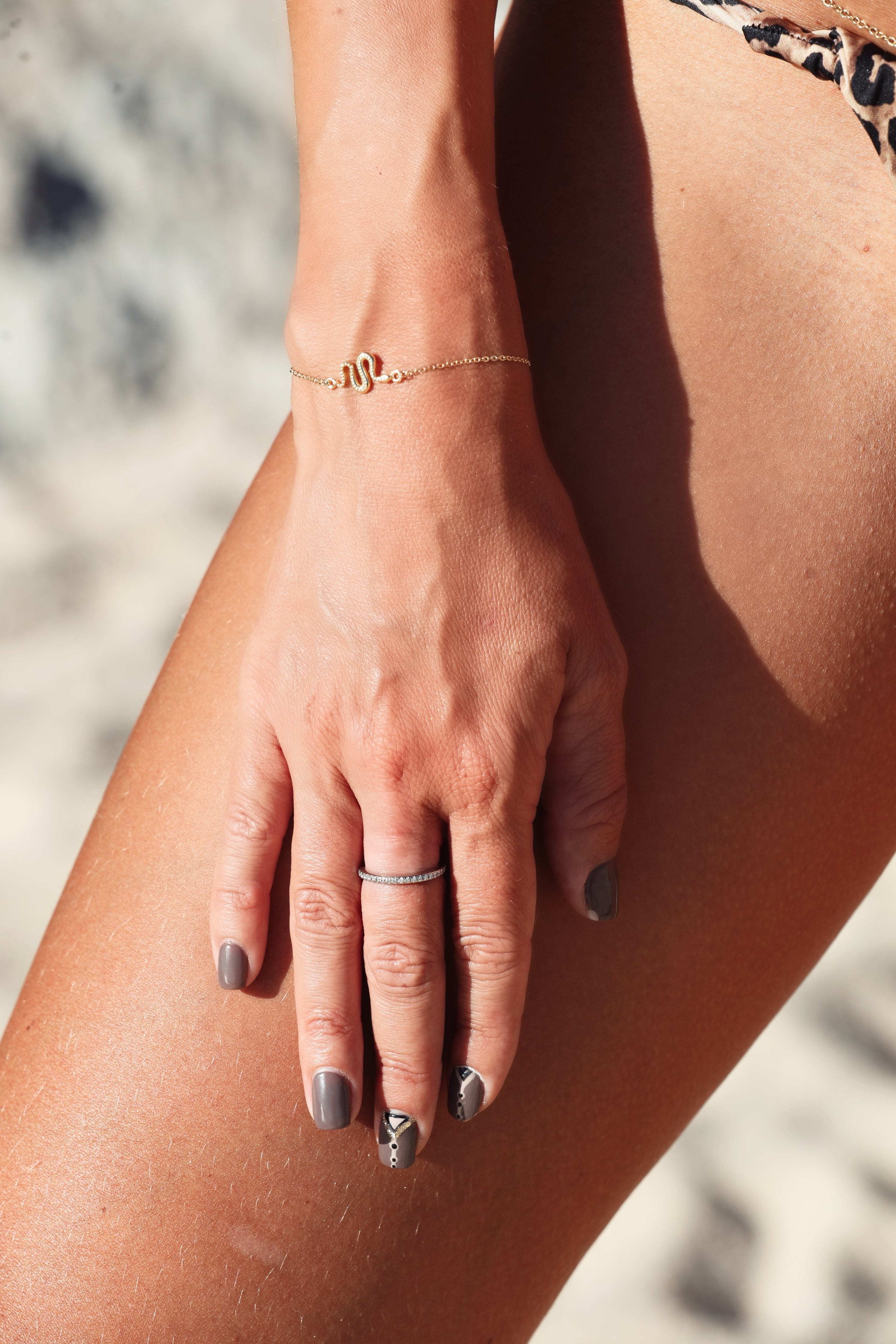 Ular serpent bracelet in gold-plated silver, worn on the wrist