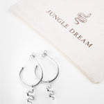 Ejo serpent earrings, flat lay product photo