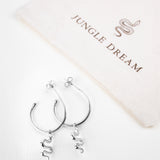 Ejo serpent earrings, flat lay product photo