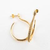 Sarpe serpent hoop earrings, close-up of the serpent curve