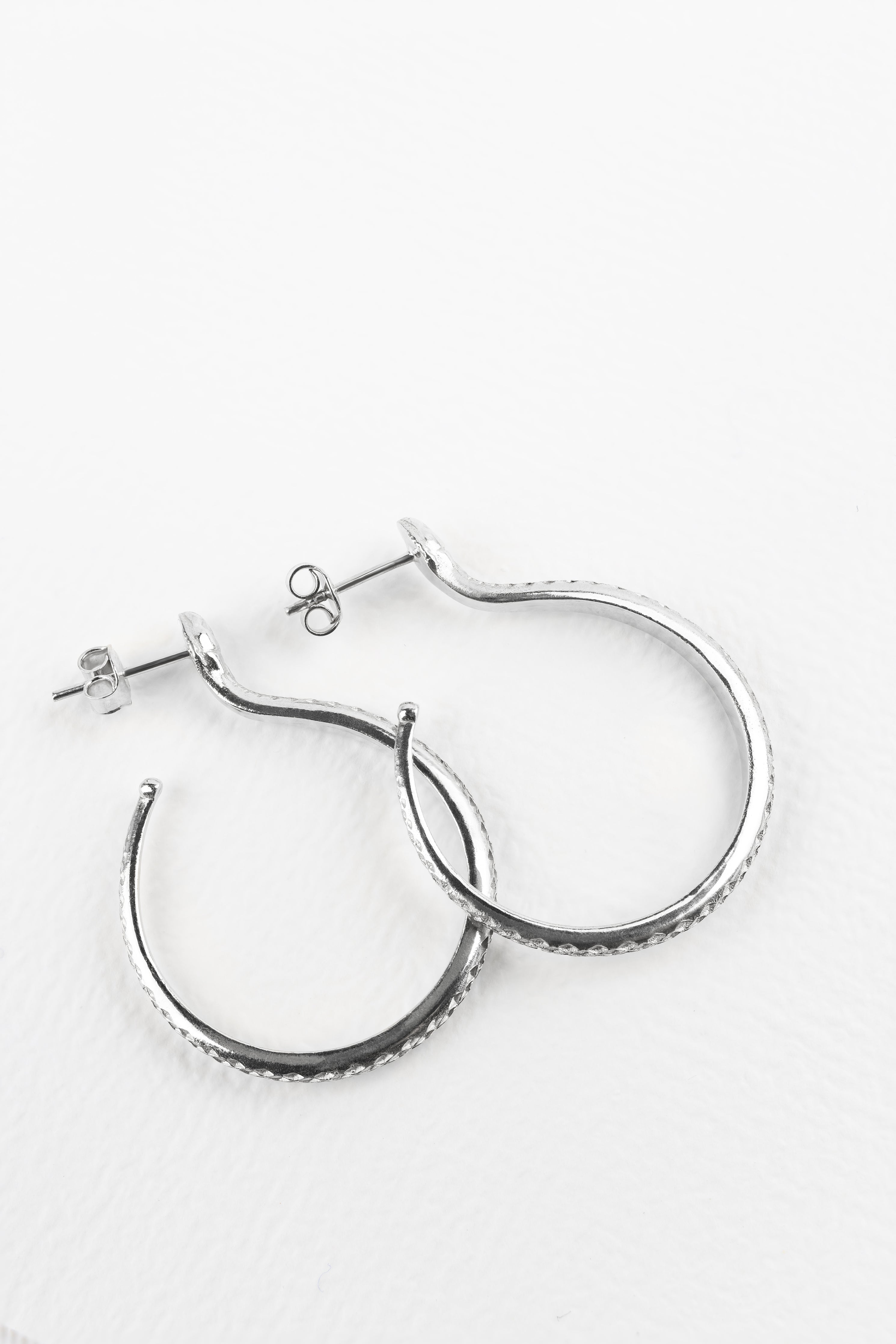 Sarpe serpent hoop earrings, close-up of serpent scale detail