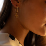 Ejo serpent earrings, product detail against a neutral background
